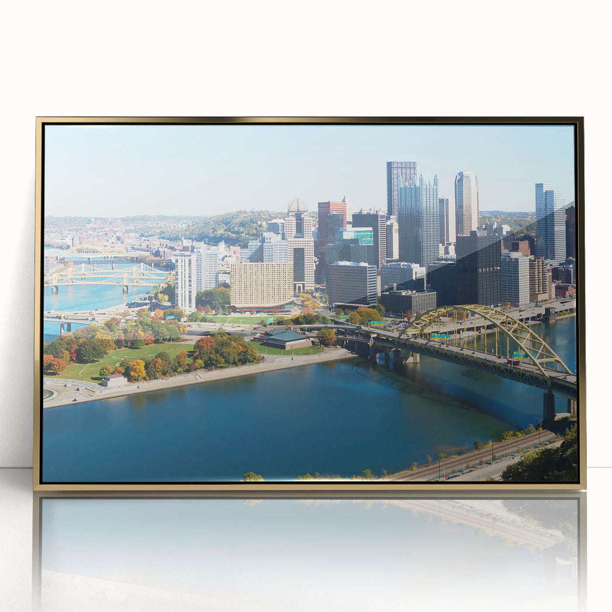 Framed acrylic print of Pittsburgh skyline in gold tones, ideal for modern art wall decor.