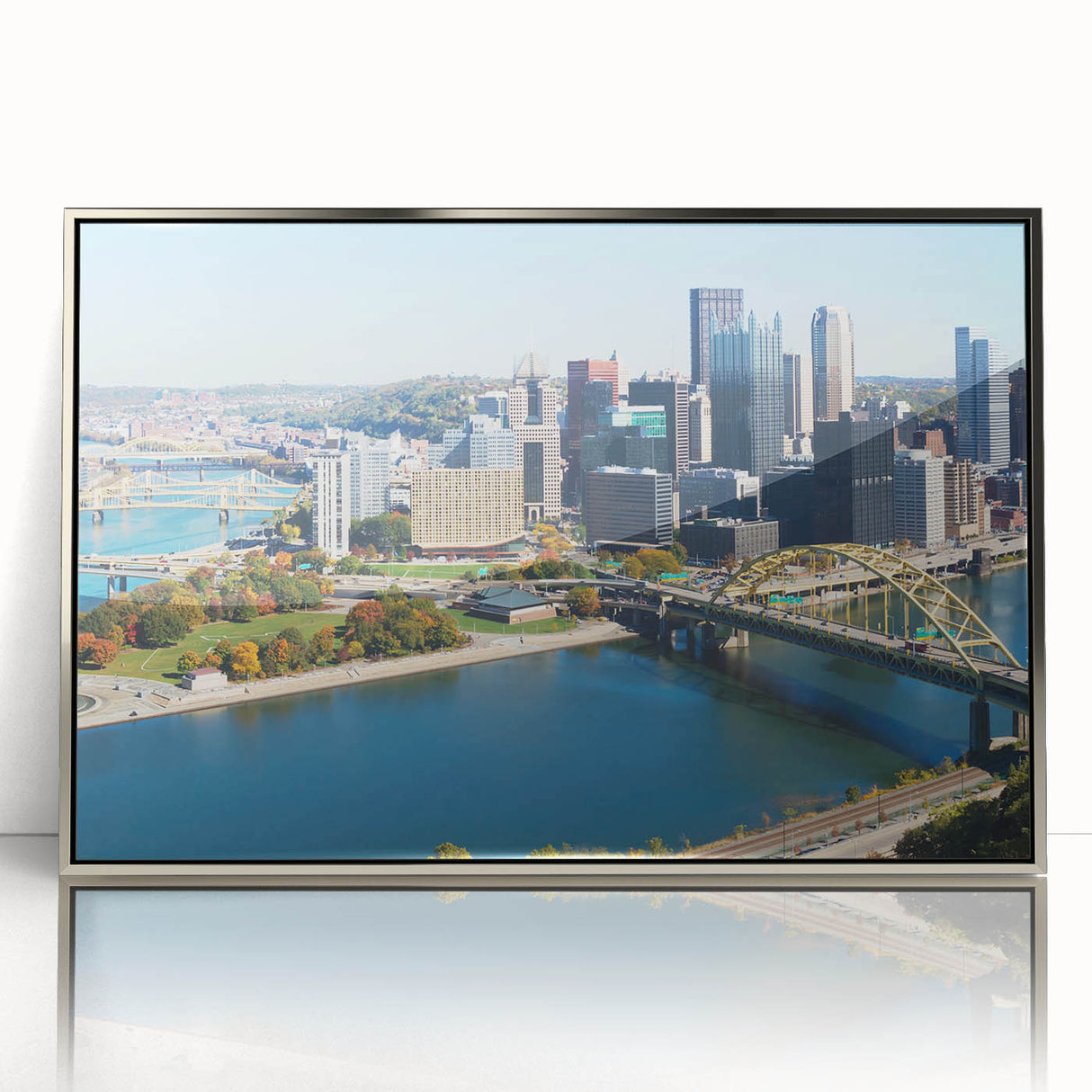 Mid-century modernist art depicting the Pittsburgh skyline, rendered in muted gray and blue tones on a framed acrylic print.