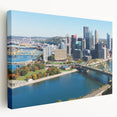 Panoramic view of Pittsburgh skyline in muted gray and blue tones on stretched canvas, ideal for kitchen wall art.