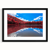 Colorful abstract art print of a textured Vermont scenery, in a large black frame with mat, ideal for living room decor.