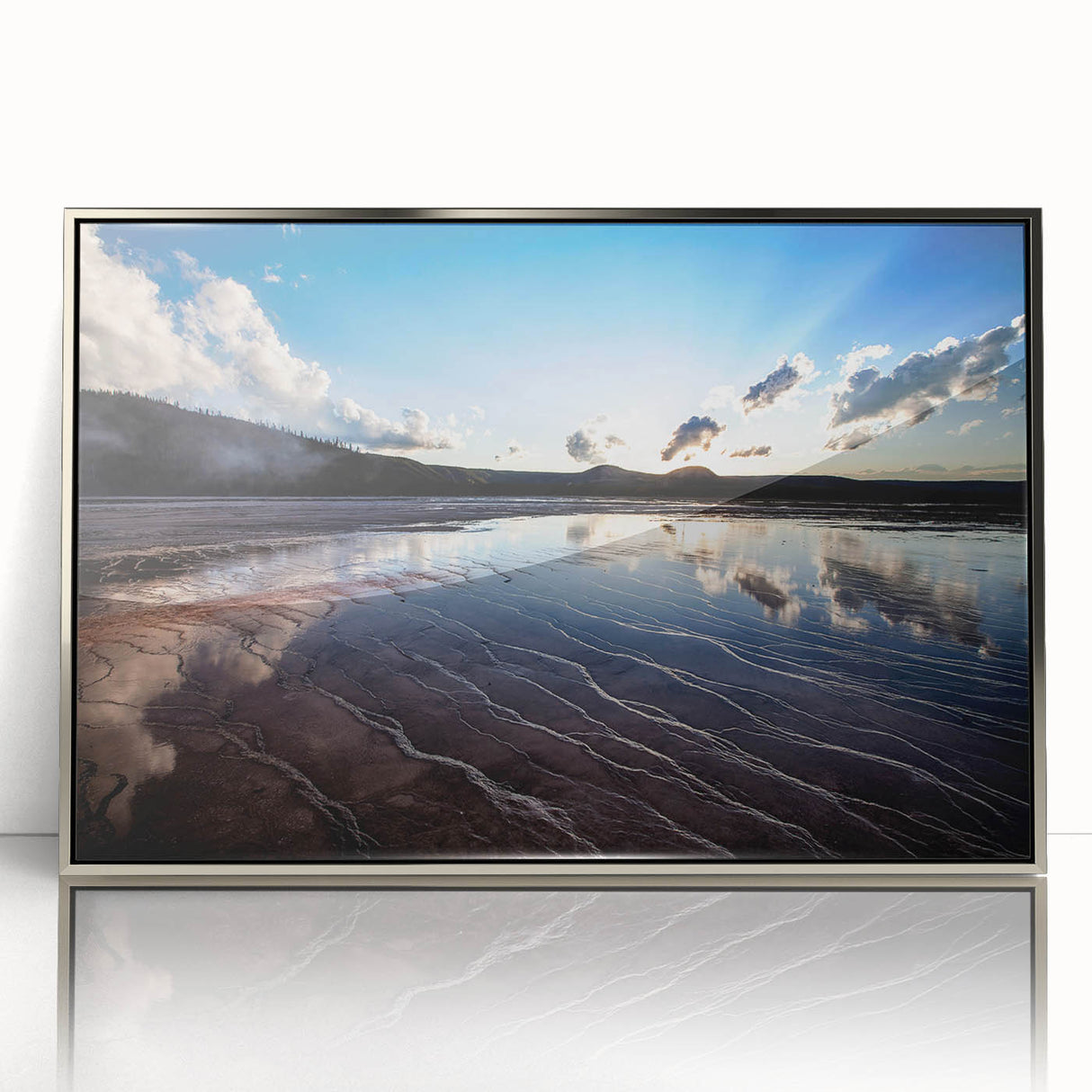 Mid-century modernist art depicting Yellowstone scenery in muted earth tones, framed in silver acrylic.