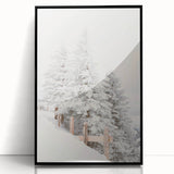Large abstract wall art depicting a winter scene in muted blue and white tones, framed in black acrylic.