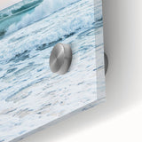 Large abstract wall art in vibrant orange and blue tones on acrylic glass, ideal for bedroom or dining room decor.