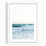 Abstract art print featuring swirling blue and green patterns on a white framed canvas.