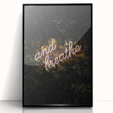 Large abstract wall art depicting autumnal hues on black framed acrylic, suitable for modern living room decor.