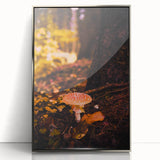 Mid-century modernist art depicting an abstract fall scene in orange and brown tones on a silver-framed acrylic print.
