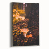 Framed canvas featuring a vintage landscape painting with colorful autumn trees and a black background.