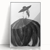 Abstract figurative wall art in a sleek white frame, showcasing vibrant colors and dynamic shapes, perfect for modern decor in living spaces or offices.