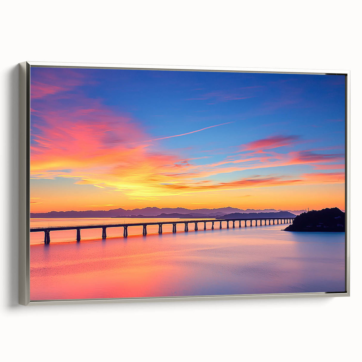 Silver-framed landscape canvas art depicting a serene bridge scene, showcasing lush greenery and tranquil waters, perfect for home decor and aesthetic enhancement.