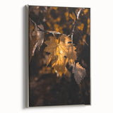Framed canvas featuring a vintage landscape art painting of autumn trees in vibrant orange and yellow tones.