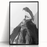 Framed abstract figurative art piece displayed in a sleek black frame, showcasing vibrant colors and dynamic shapes, perfect for modern home decor accents.