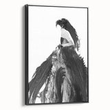 Framed abstract figurative canvas artwork showcasing dynamic shapes and bold colors, displayed from a side view against a neutral background. Ideal for modern decor.