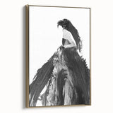 Framed abstract figurative canvas art in a gold frame, showcasing elegant curves and vibrant colors, perfect for modern home decor and artistic expression.