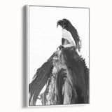 Framed canvas artwork depicting an abstract figurative design in white, showcasing elegant lines and shapes, perfect for modern home decor and adding sophistication to any room.