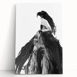 Abstract figurative art canvas featuring vibrant colors and dynamic shapes, elegantly leaning against a minimalist wall, perfect for modern home decor.