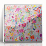 Framed wall art featuring an abstract floral design in vibrant colors, set against a sleek white background, perfect for modern home decor and interior styling.