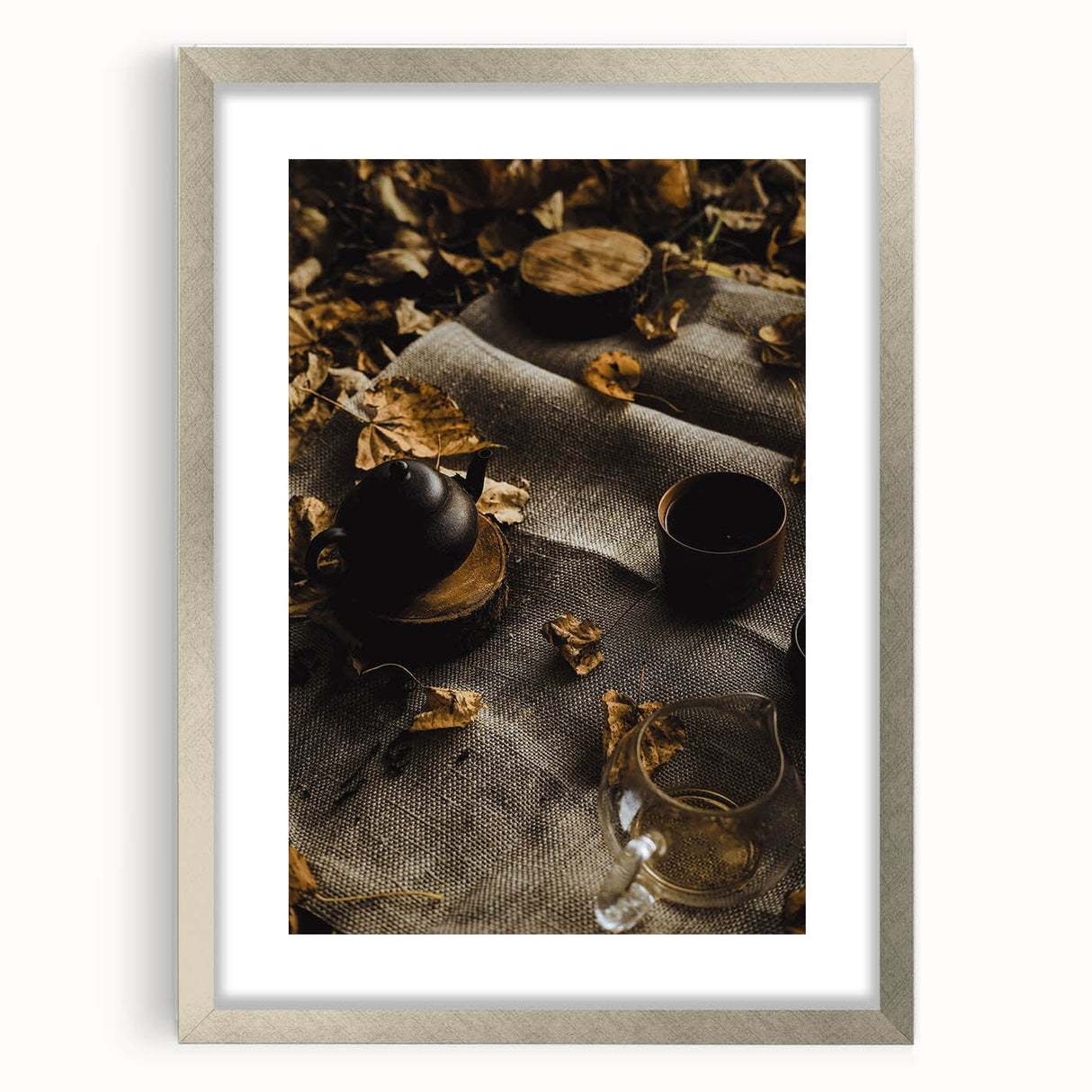 Textured abstract art print depicting autumnal hues on a silver-framed canvas, suitable for bedroom decor.