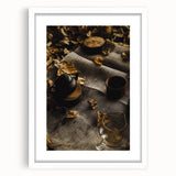 Abstract art print depicting autumn leaves in muted orange and brown, framed in white.