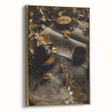 Framed canvas featuring a vintage landscape painting of an autumnal scene with muted gold and black tones.