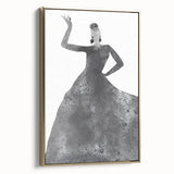 Abstract figurative art piece in a gold frame, showcasing vibrant colors and dynamic shapes, displayed from a side view against a neutral backdrop.