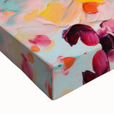 Close-up of a vibrant abstract floral wall art design on stretched canvas, featuring bold colors like pink, blue, and green, perfect for modern home decor.