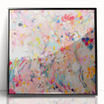 Framed wall art showcasing an abstract floral design with vibrant colors, presented in a sleek black frame, ideal for modern home decor and interior styling.