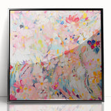 Framed wall art showcasing an abstract floral design with vibrant colors, presented in a sleek black frame, ideal for modern home decor and interior styling.