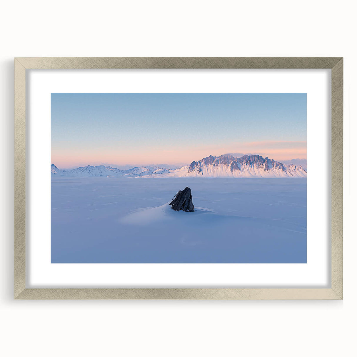 Framed landscape artwork showcasing serene sand dunes in soft beige and gold tones, accented with a sleek silver mat, perfect for modern decor.