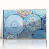 Large acrylic print of a Moroccan landscape in muted earth tones, framed in white, suitable for modern nursery decor.