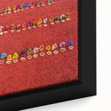 Close-up of extra large framed canvas featuring a textured, colorful abstract design on a black background.