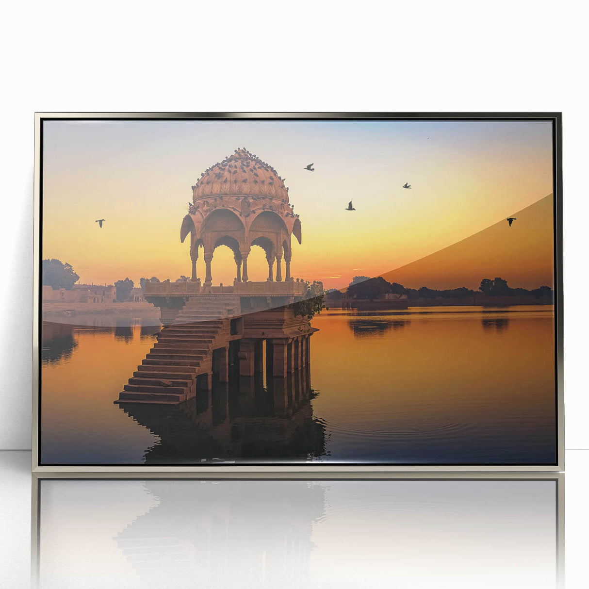 Mid-century modernist art depicting an Indian landscape in muted earth tones, framed in silver acrylic.