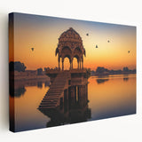 Large art depicting a serene Indian landscape on stretched canvas, featuring earthy green and brown tones.