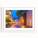 Abstract art print of Quebec scenery in muted blue and green hues on a framed white mat, suitable for dining room decor.