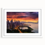 Abstract art print of a Central American scenery in muted green and blue tones, framed with a white mat.