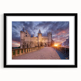 Abstract art print featuring textured, colorful swirls in vibrant hues, framed in black, ideal for living room decor.