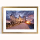 Abstract art print of a European scenery in muted gold and green tones, framed with a gold mat, ideal for dining room decor.