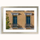 Extra large abstract art print of a textured European scenery in muted earth tones, framed in silver.