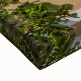 Large art of a black and white landscape painting depicting a serene European countryside on stretched canvas.