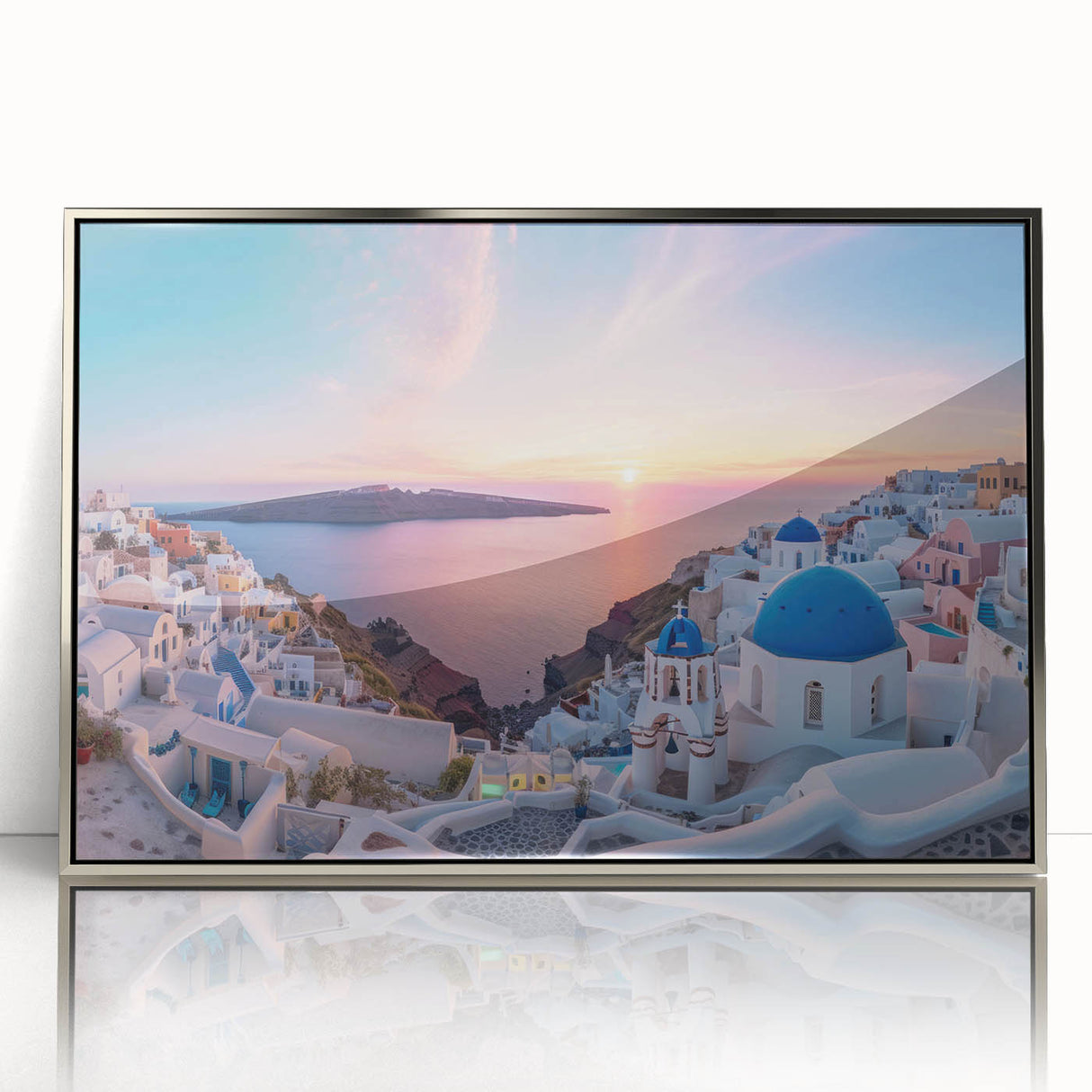 Large art print of a Santorini landscape in muted blue and white tones on a silver-framed acrylic.