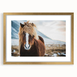 Abstract art print of a European landscape in muted gold and green tones on a framed canvas, suitable for dining room decor.