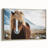 Framed canvas wall art depicting a vintage-style Icelandic landscape in muted gold and black tones, ideal for bedroom decor.