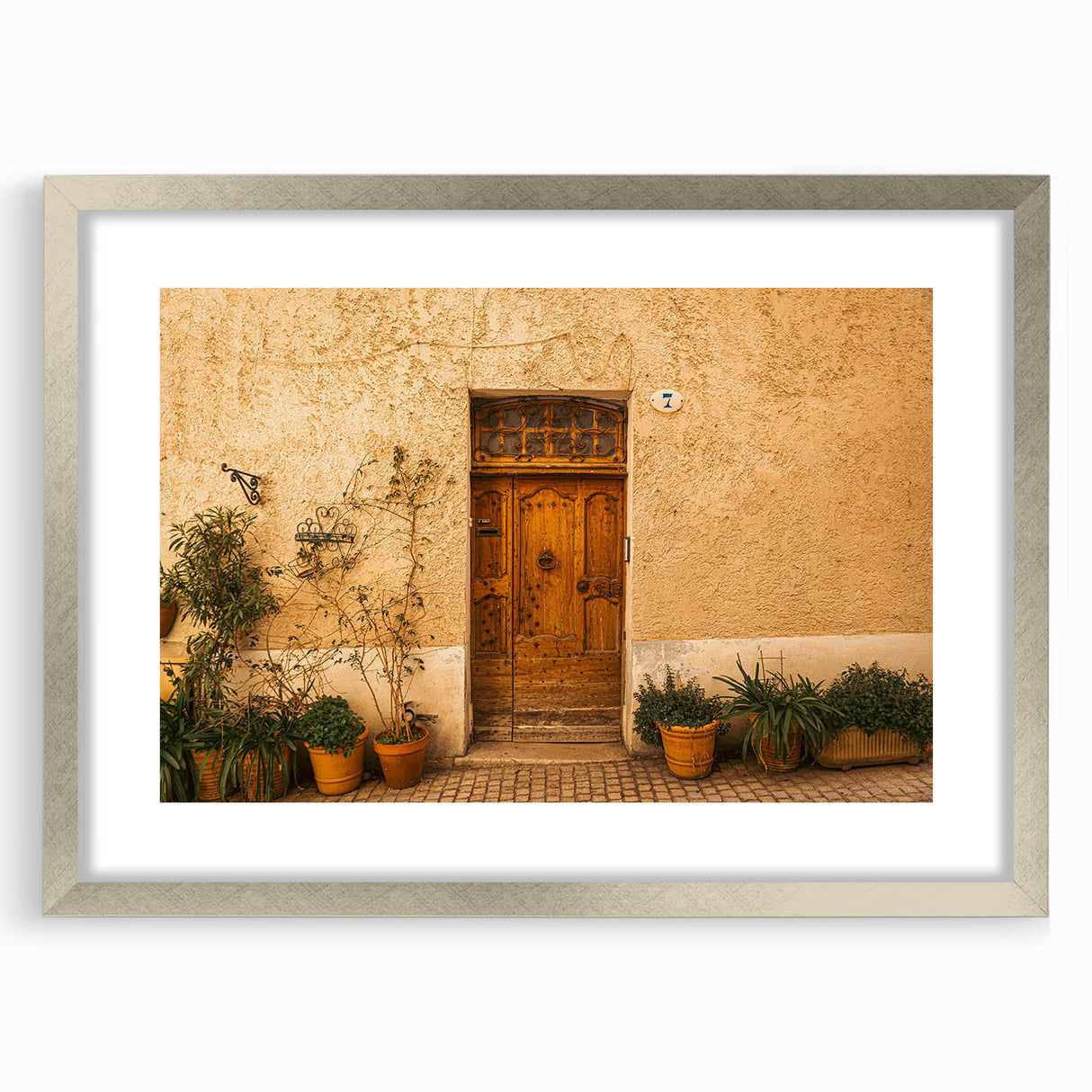 Extra large abstract art print of Tuscan scenery in muted earth tones on a textured canvas, framed in silver.