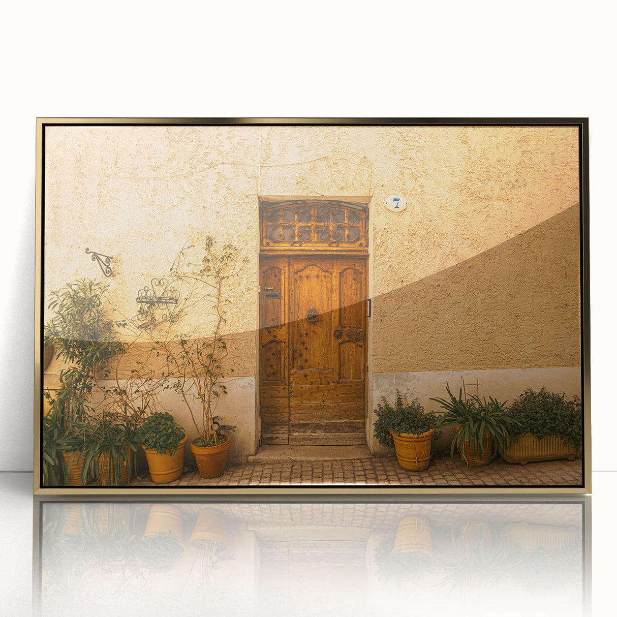 Acrylic print of a Tuscan landscape in soft, earthy tones, framed in gold, suitable for modern art wall decor or a nursery.