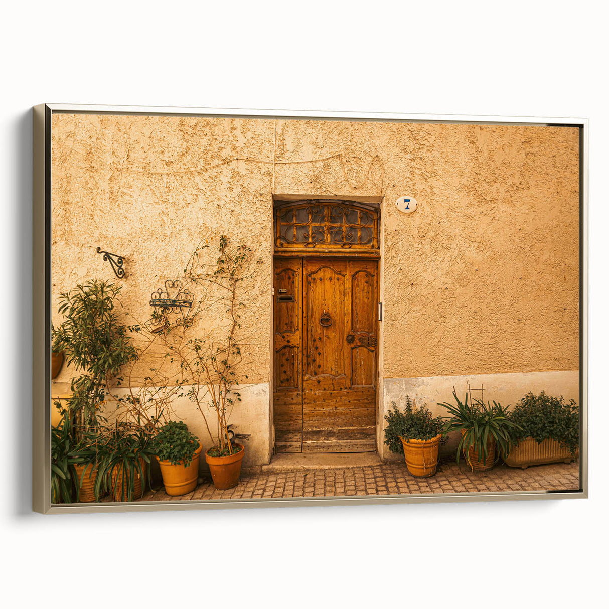 Framed canvas featuring a vintage-style landscape painting of Tuscany with muted earth tones, ideal for bedroom wall art.