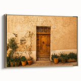 Framed canvas featuring a vintage-style landscape painting of Tuscany with muted earth tones, ideal for bedroom wall art.