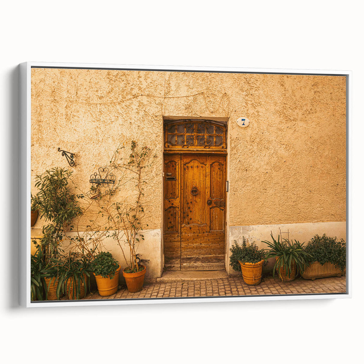 Vintage poster art of a Tuscan landscape on a framed canvas, featuring vibrant green and earth tones.