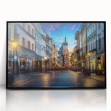 Large abstract wall art depicting a European scenery in muted earth tones on a black framed acrylic.