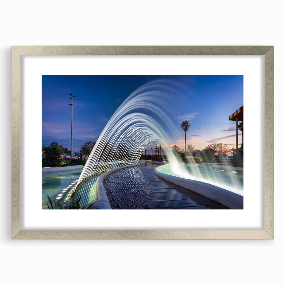 Textured abstract art print depicting a European scenery in muted earth tones, framed in silver, suitable for bedroom decor.