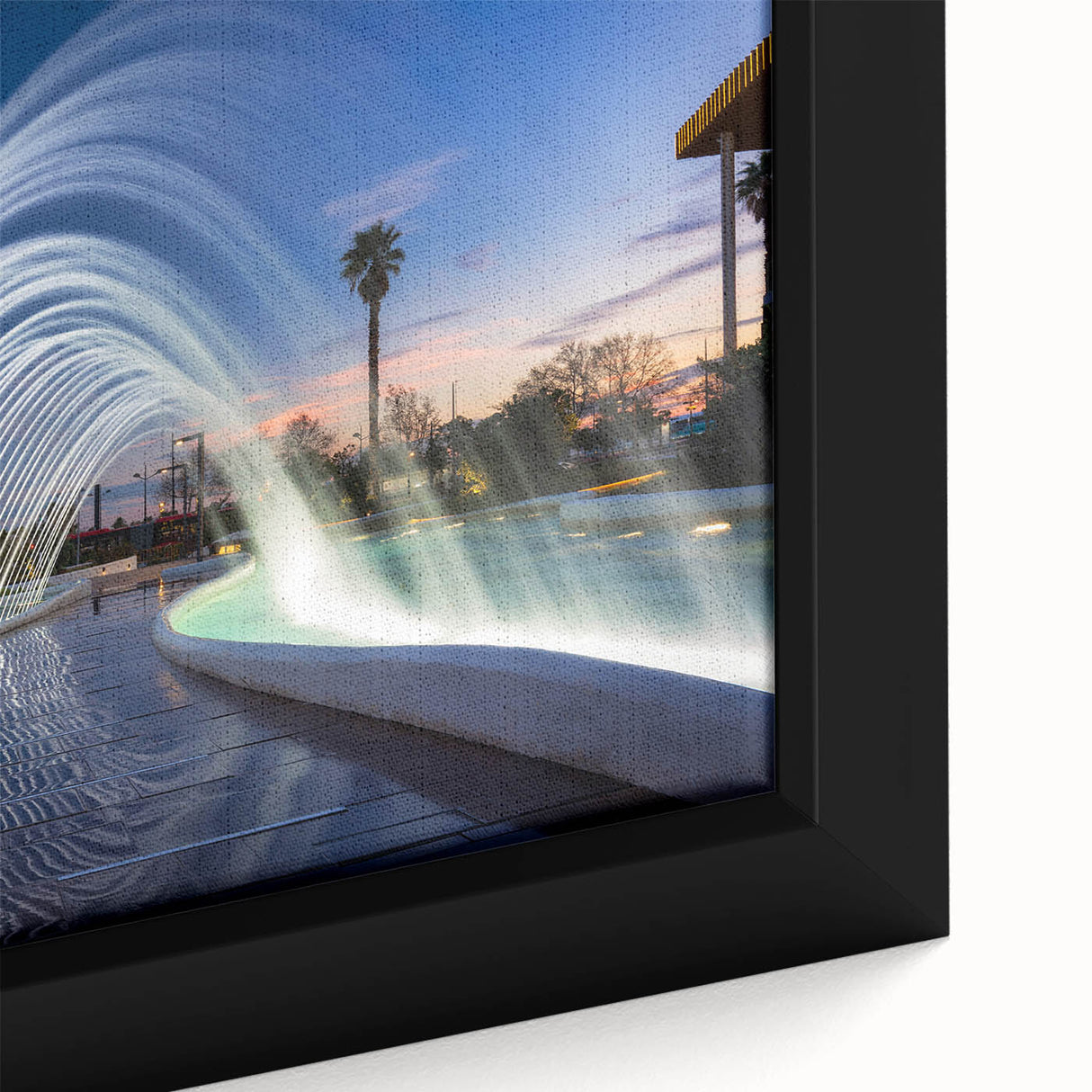 Close-up of black wall art featuring a textured, colorful depiction of Valencia, Spain on a framed canvas.