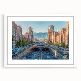 Abstract art print of a Middle Eastern scenery in muted earth tones on a white-framed mat.